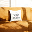 Habibi Personalized Cushion Gift with 'Yalla Habibi' text in Arabic and English, placed on a tan sofa. Ideal for home decor and gifting.