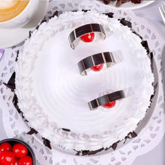 Top view of Black Forest Cake Online - Order Now | Chocolate & Cherry Delight with decorative cream swirls, cherries, and chocolate curls. Perfect for same day delivery.