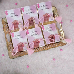 Pink Little Hands Tasbeeh Keepsakes arranged on a tray, personalized for Aqiqah events, under Religious Prayer Beads category.
