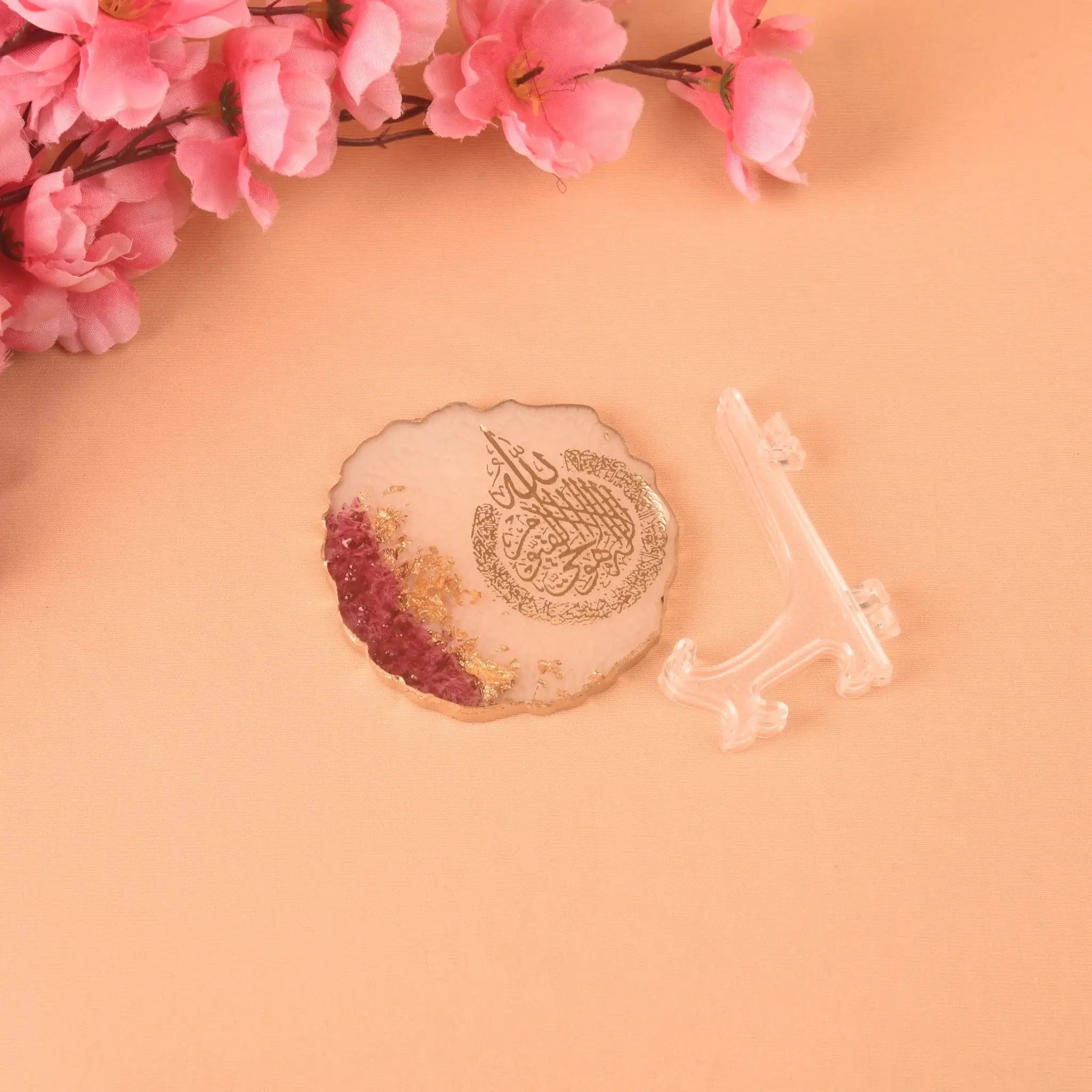 Flat-lay of 3" Ayatul Kursi Floral Frame with gold and pink floral design, shown beside its clear display stand, perfect for Islamic home decoration.