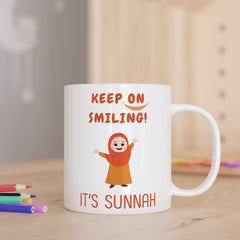 Keep On Smiling Sunnah Mug - Sunnah Smiling Mug | Ceramic, 350ml featuring a cheerful girl in hijab illustration with uplifting Islamic message.
