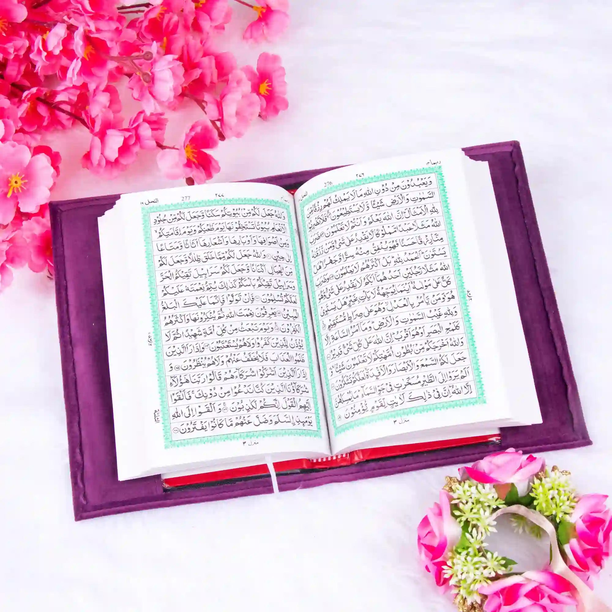Open velvet Quran with Arabic script and floral decor. Part of the Purple Sequence Rehal Hamper, ideal for ceremonial gifting.