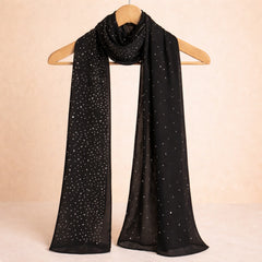 Black studded hijab with shimmering accents displayed on a hanger, highlighting its elegant drape and versatile styling for scarves and shawls.
