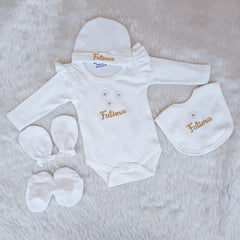 Baby clothing set with 'Fatima' embroidery on a soft surface