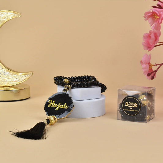 Black Crystal Tasbeeh with Name - 100 Beads displayed on a white box with gold accents, ideal handmade Islamic gift for Ramadan or Eid.