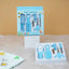 Baby care kit with tools and packaging on a beige surface