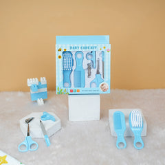 Baby care kit with tools and packaging on a textured surface