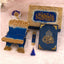 Decorative set with blue and gold elements on a light pink background