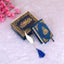 Blue Stones Mini Tilawat-e-Quran velvet gift set with gold detailing, compact Quran, and feather-shaped bookmark on soft pink background.