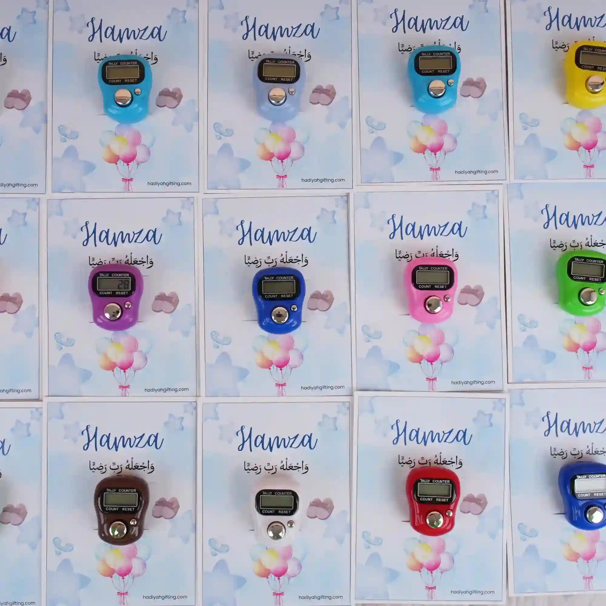 Assorted digital Tasbeeh Favors on Hamza-themed cards, colorful Islamic gifts for Aqiqah or wedding ceremonies, minimum order 50.
