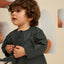 Charcoal Green Thobe Romper - EID Baby Thobe Romper styled on a toddler boy with curly hair, perfect for Ramadan and Eid celebrations.