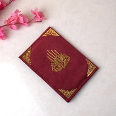 Open Noorani Qaida showing Arabic letters and vowel markings for early learners"