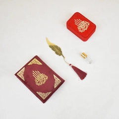 Elegant Islamic gift hamper with Quran, Tasbeeh combo, Ittar, and floral accents arranged in a rustic wooden tray
