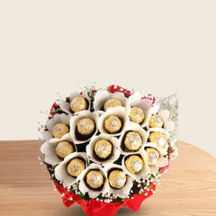 Ferrero Rocher Bunch - Chocolate Bouquet | 16 Piece Pack arranged in red and white paper with green fillers and white ribbon, perfect for gifting.