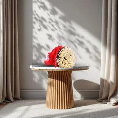 Ferrero Rocher Bunch - Chocolate Bouquet | 16 Piece Pack arranged in red and white wrapping with green fillers and white ribbon on a marble table.