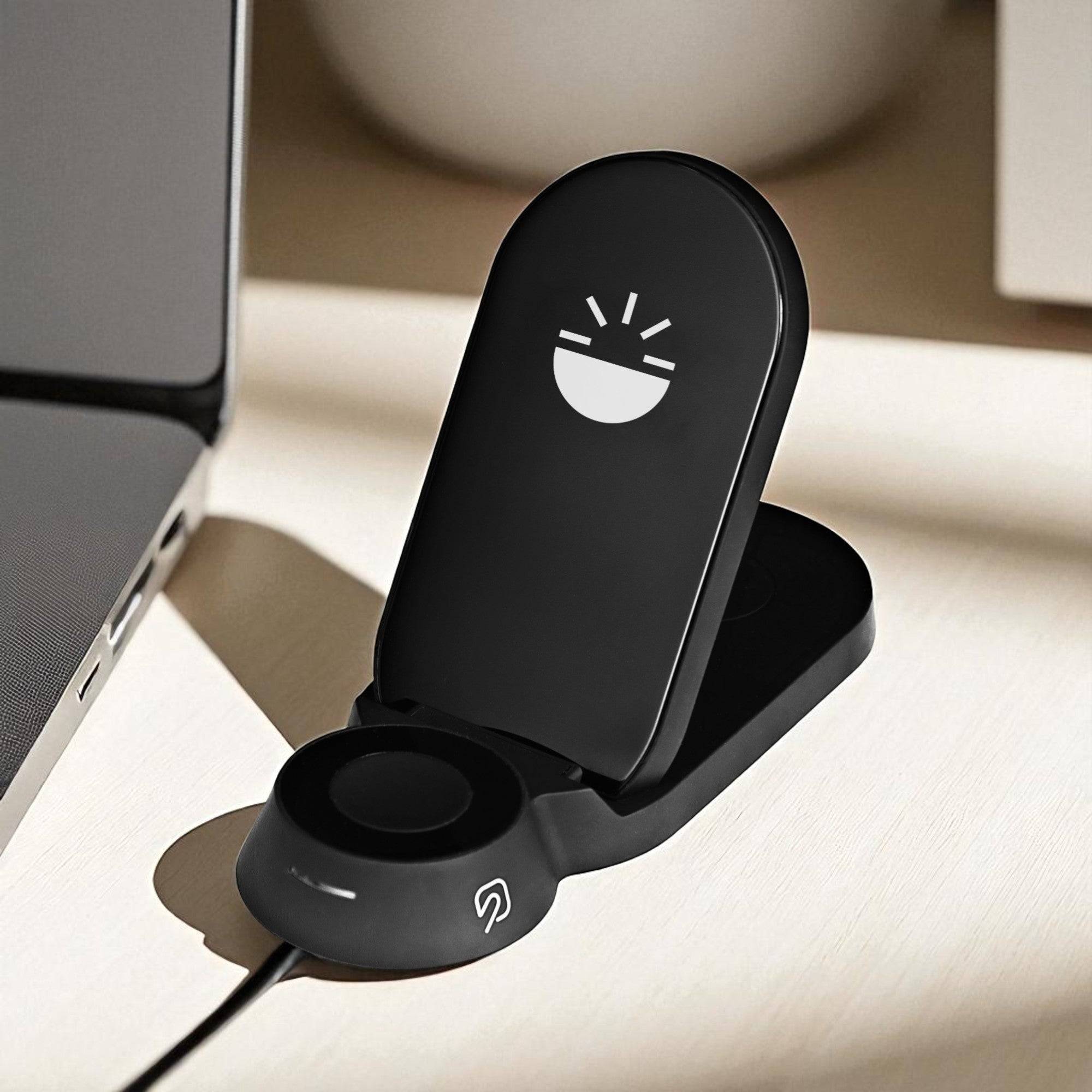 Flare Dock 3 in 1 Wireless Charger with sleek black design, positioned near a laptop, ready to charge multiple devices simultaneously.