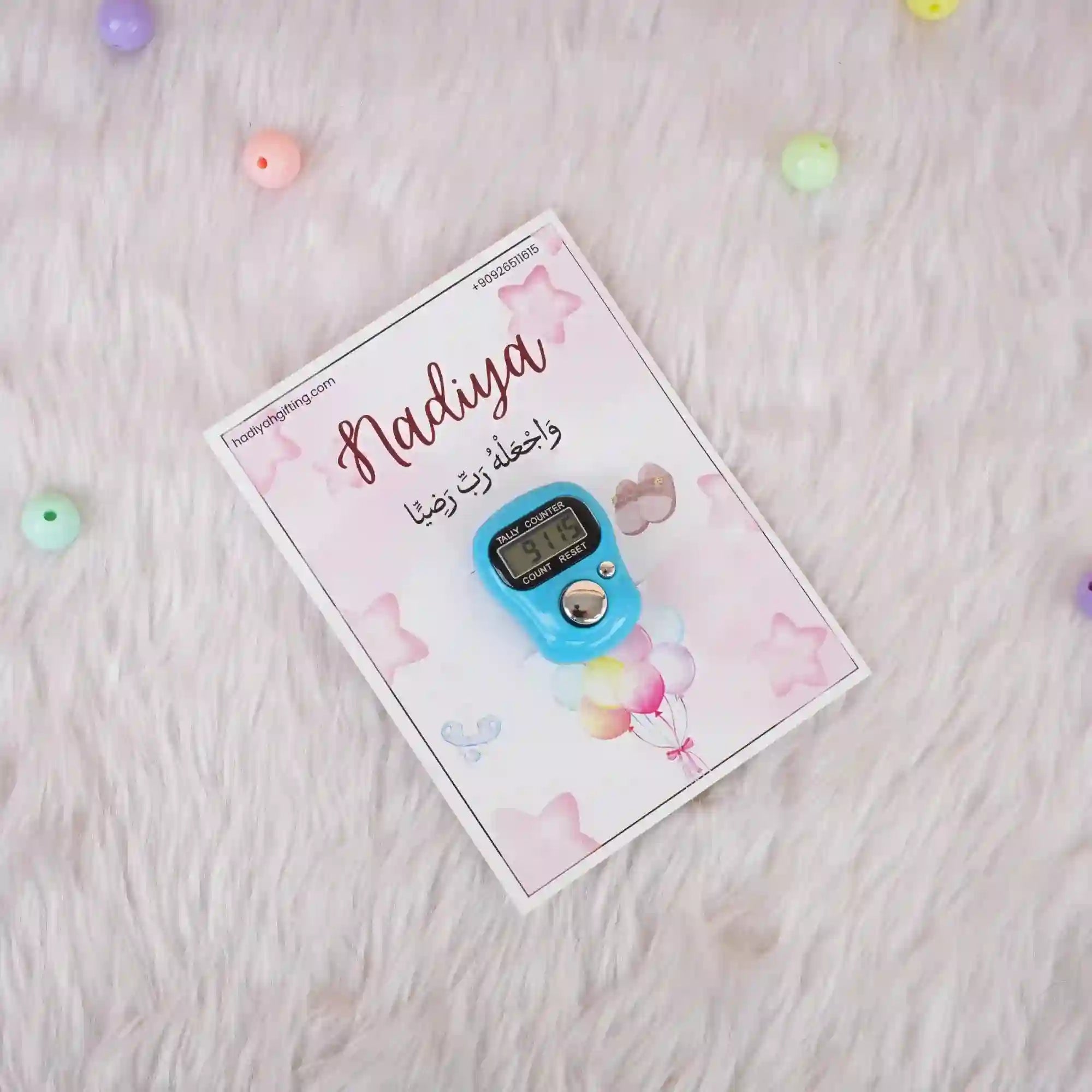 Single blue digital Tasbeeh Favor on a soft pink Nadiya card, ideal for Islamic Aqiqah or wedding ceremony keepsakes.