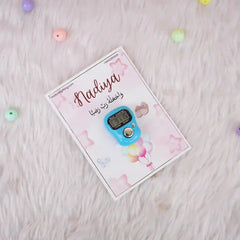 Single blue digital Tasbeeh Favor on a soft pink Nadiya card, ideal for Islamic Aqiqah or wedding ceremony keepsakes.