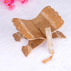 Golden resin Quran stand with glitter finish from the Bling Collection, part of the Sawab-e-Jariya spiritual gift set.