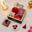Golden Ramadan Mubarak Hamper with red hijab, Islamic book, dates, sweets, and elegant Ramadan-themed packaging for gifting.