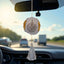 Grey Flakes Designer Car Hanging - 3 inches with shimmering flake pattern and tassel, hanging from rear view mirror on a highway drive.