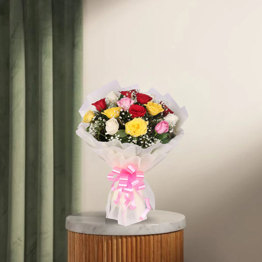 Modern Romance - Modern Bouquet with Mixed Roses featuring red, white, pink, and yellow premium roses wrapped in white paper with a pink bow.