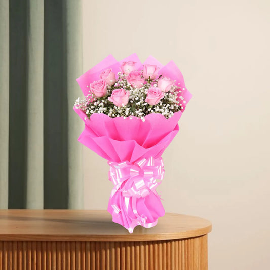 Exotic Pink Roses Bouquet with 8 pink roses, white fillers, and pink ribbon wrap. Ideal for expressing affection or gifting on special occasions.