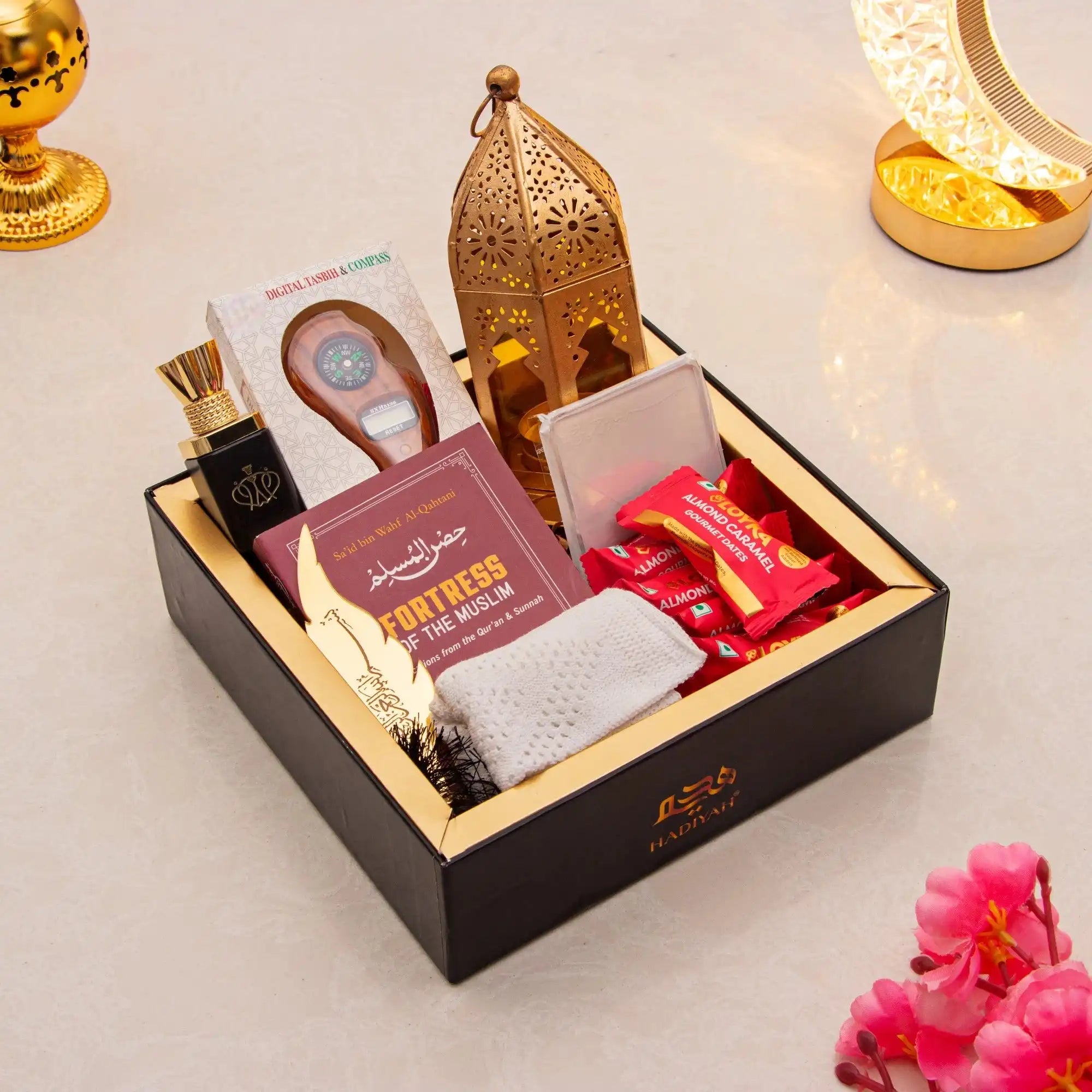 Hadiyah Harmony Hamper - Spiritual Gift Box with tasbeeh, Islamic book, dates, prayer mat, and lantern. Ideal religious gift for weddings or housewarmings.