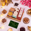 Assorted food items and packaging on a white surface with decorative elements.