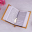 Golden Sequence Rehal Hamper Quran open to Hindi translation pages with golden bookmark. Inclusive Islamic gift set for diverse readers.