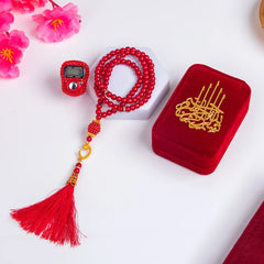 Red tasbeeh with digital counter and velvet box from Noor Al-Barakah Gourmet Hamper, a thoughtful Islamic gift for weddings and Umrah celebrations.