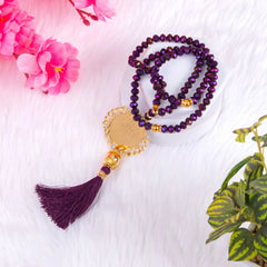 Close-up of Purple Crystal Tasbeeh with Bismillah charm and golden accents, 100 beads, perfect for bridal or religious gifting.