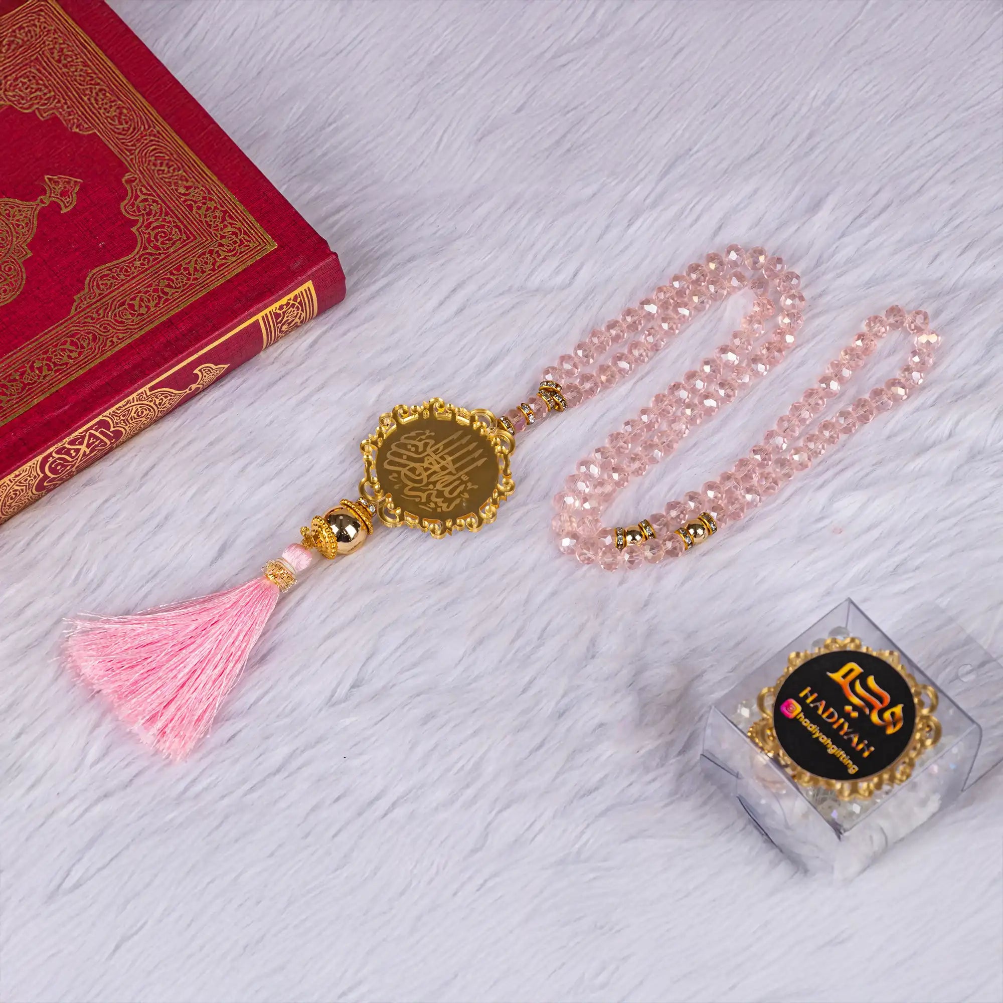 Pink crystal tasbeeh with gold Islamic medallion and tassel from the Pink Flakes Rehal Bridal Gift. Ideal for bridal or religious gifting.