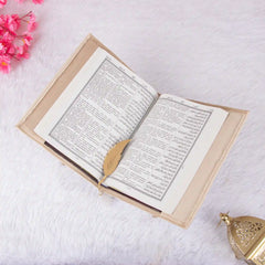 Velvet-covered green Quran with gold Islamic calligraphy from the Green Stones Rehal Hamper. Elegant and spiritual Islamic gift set.