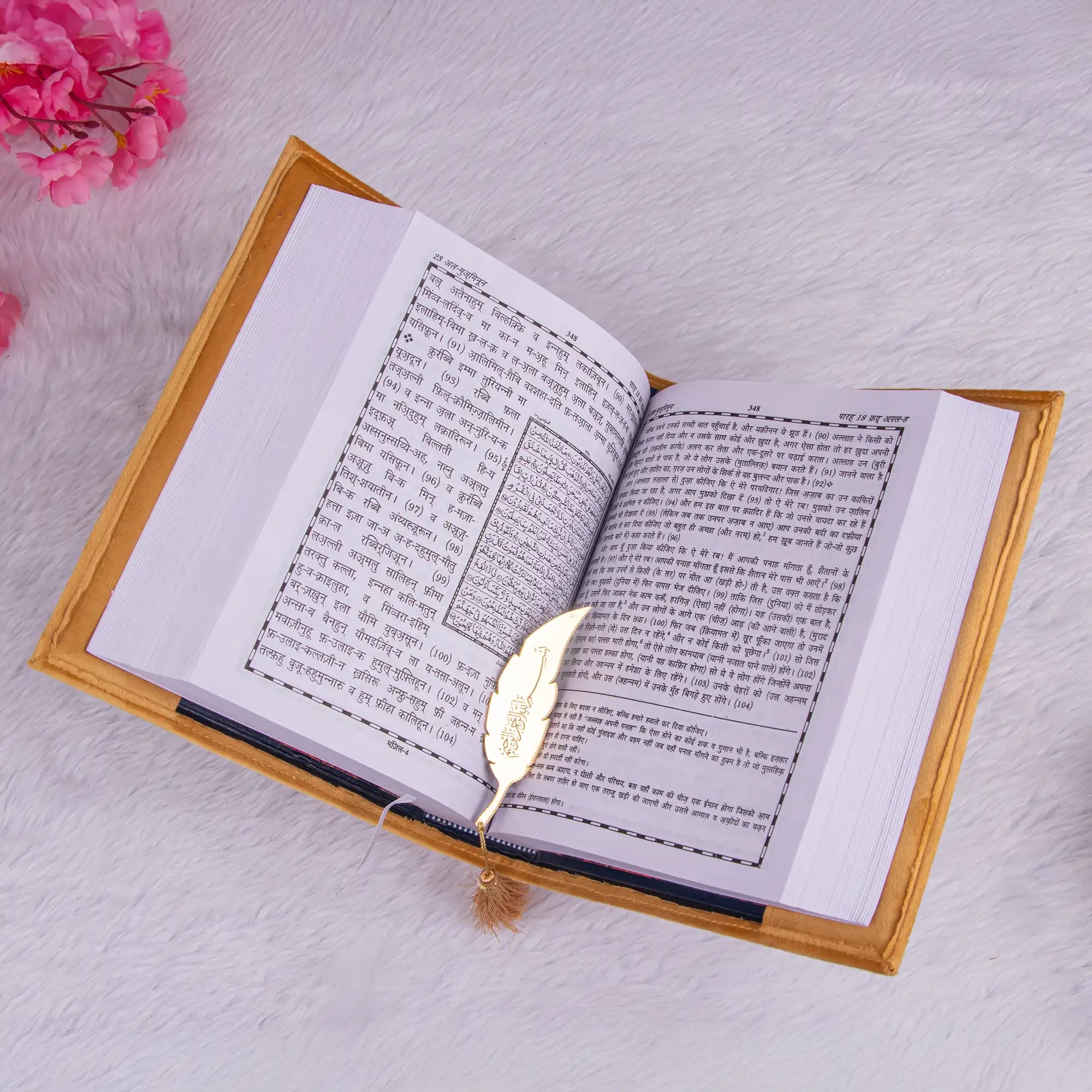 Golden Velvet Quran Translation featuring Hindi text, paired with a decorative feather bookmark. A thoughtful handmade gift for spiritual moments.
