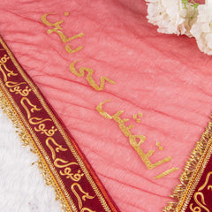 Close-up of pink bridal dupatta with golden Urdu script and maroon border from Amaanat-e-Nikaah Bridal Bling Collection.