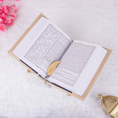 Offwhite Rehal Gift Hamper featuring an open Velvet Quran with gold feather bookmark on a decorative Rehal. Ideal Quran gift set for religious occasions.