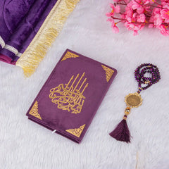Customised Purple Salah Combo Hamper featuring a velvet Quran, crystal tasbeeh, and janamaz on a white fur background with pink flowers.
