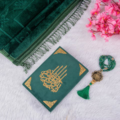 Green Salah Combo Hamper with velvet Quran, prayer mat, and crystal tasbeeh on white fur background, ideal for Islamic gifting.