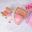 Top view of Pink Sequence Bridal Hamper - Sawab-e-Jariya featuring glitter Rehal, premium Quran, and accessories in a designer box.