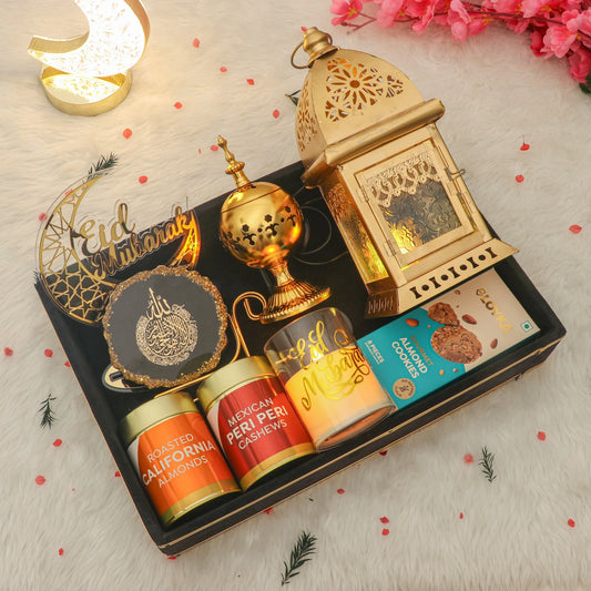 Sukoon Eid Hamper - Eid Hamper Gifts | Premium Items featuring golden lantern, bakhoor burner, nuts, cookies, and Eid Mubarak decor in a gift box.