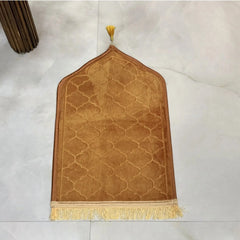 Golden Kids Dome Janamaz - Prayer Rug | Soft Fabric, Portable. Close-up of golden dome-shaped kids Janamaz with tassels, laid on marble floor.