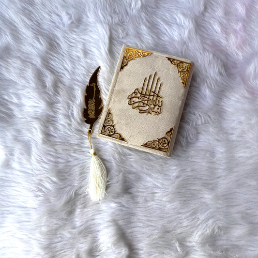 Offwhite Mini Quran in velvet gift box with gold detailing and premium feather bookmark, ideal for religious gifts and prayer essentials.
