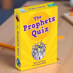 Yellow box of 'The Prophets Quiz' on a wooden surface with pencils.