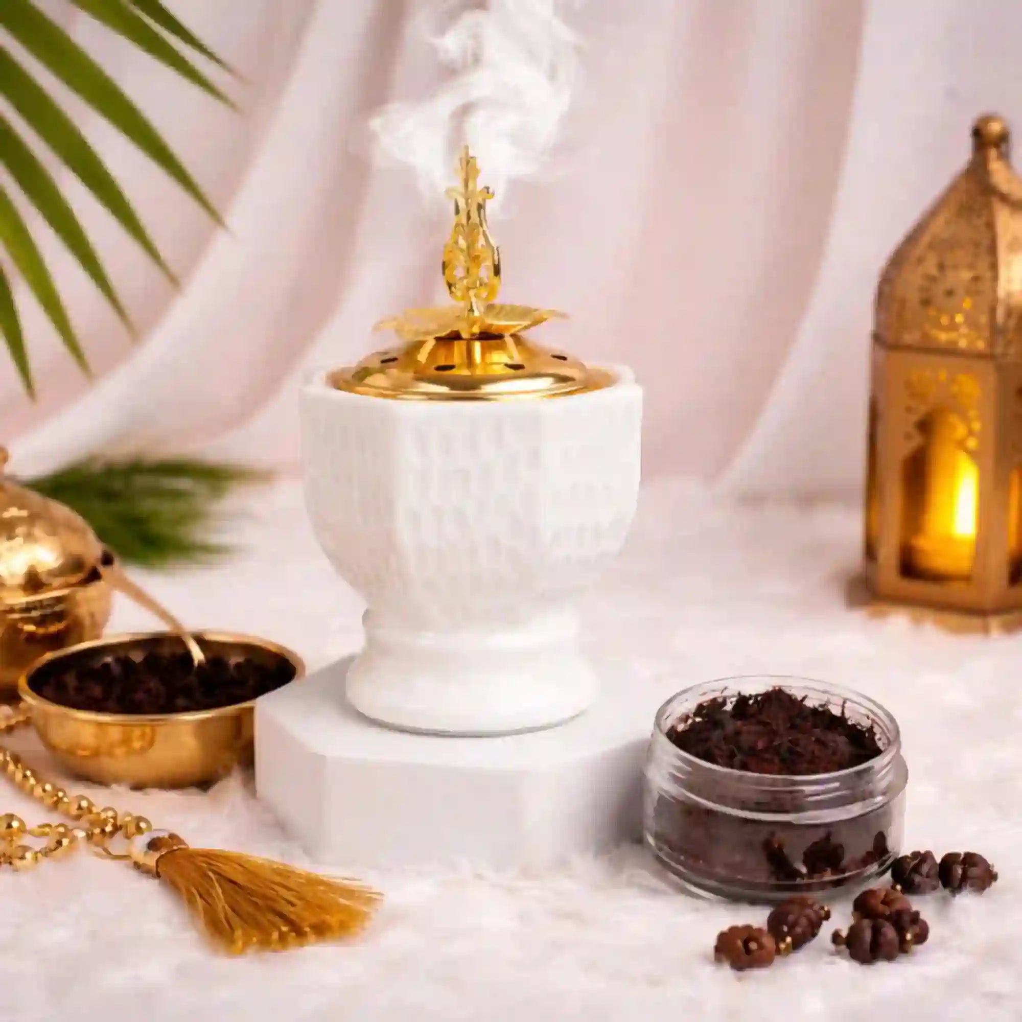 Ivory Royale Bakhoor Burner with gold crown lid emitting smoke, ideal for Ramadan & EID home decor and luxury incense rituals.