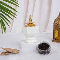 Ivory Royale Bakhoor Burner with gold crown lid, ideal for Ramadan & EID home decor, placed on a white fur surface with incense and lantern.