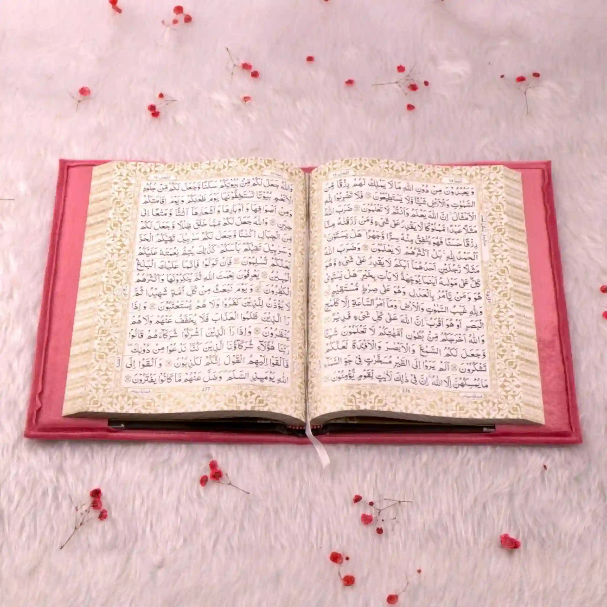 Open pink velvet Quran with Arabic script and gold border, part of the Sawab-e-Jariya bridal gift hamper. Ideal for Islamic ceremonies.