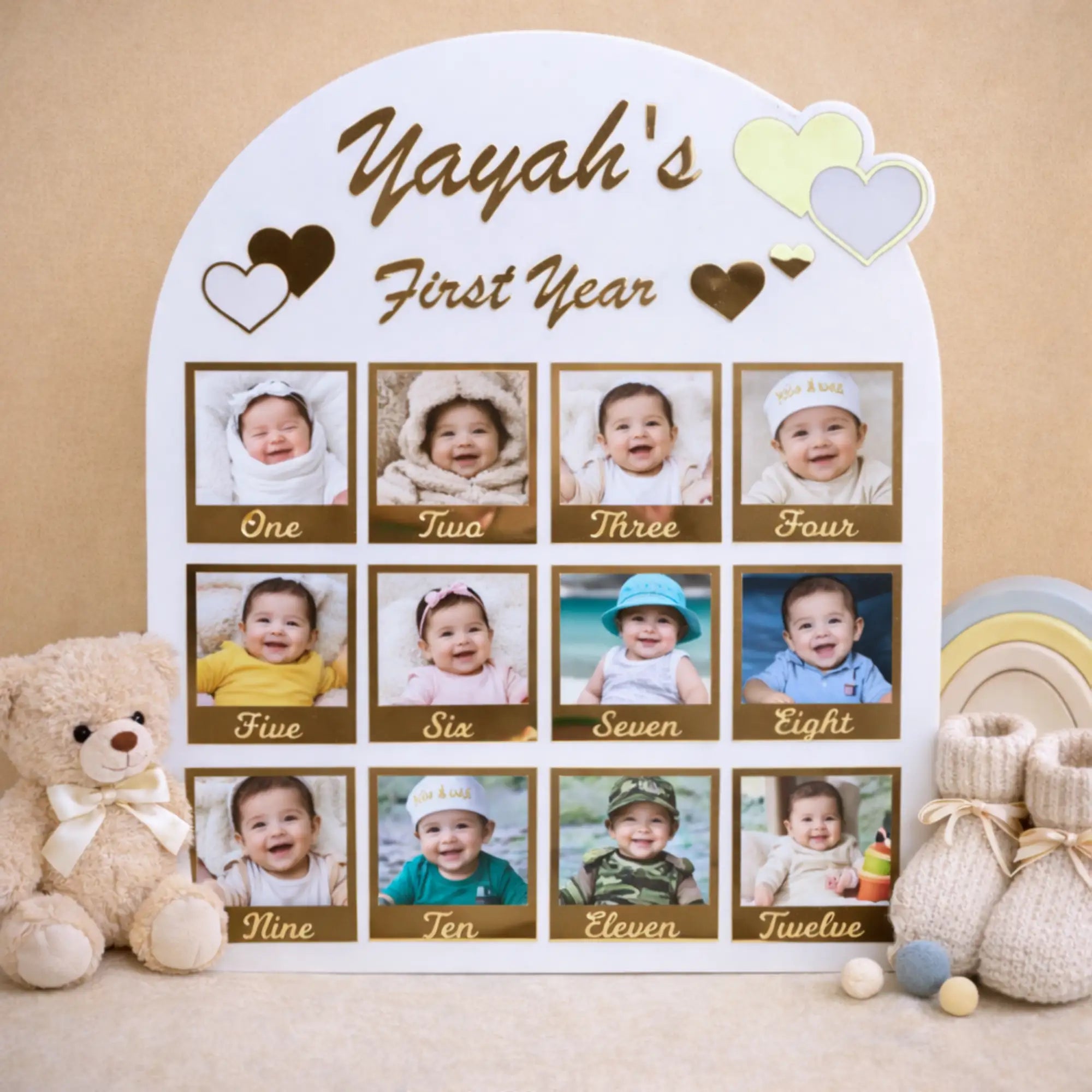 Personalized photo collage for a baby's first year with teddy bear and baby booties on a beige background.