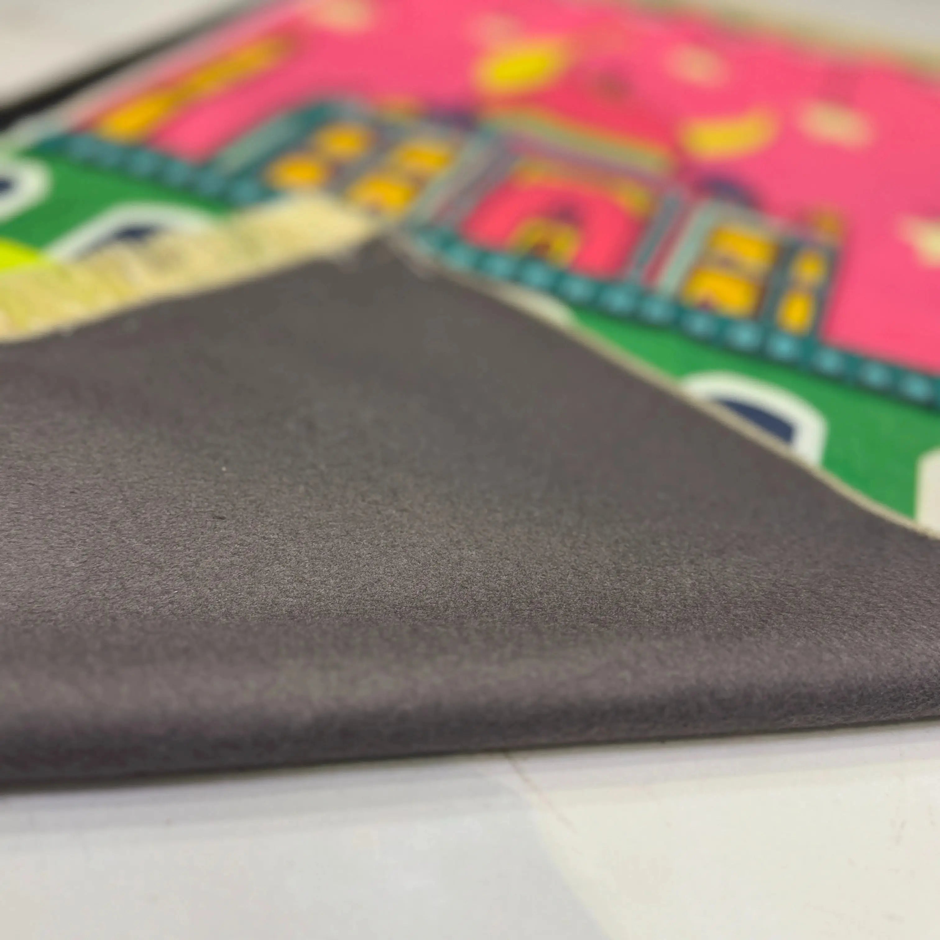 Close-up of the Little Hajj Explorer Mat - Kids Prayer Mat showing soft, non-slip backing. Durable and easy to clean for everyday use.