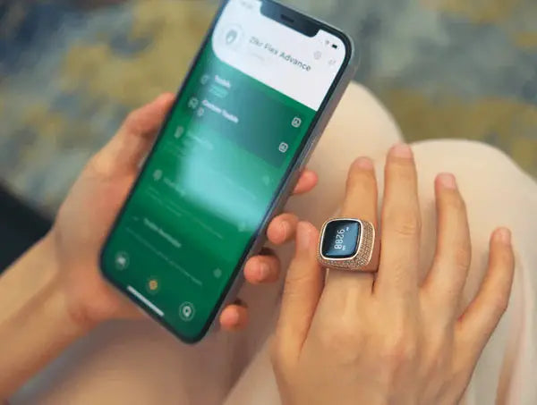 Person using smartphone app synced with rose gold Zikr Ring with 99 Zirconia. Smart Islamic ring for digital tasbeeh and prayer tracking.